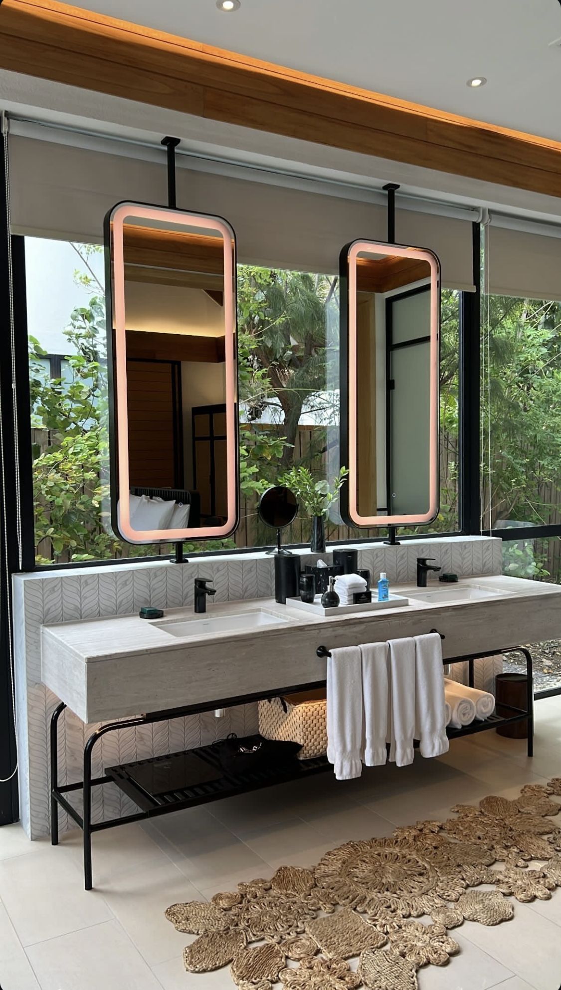 Bronze framed mirror cabinets in a commercial washroom
