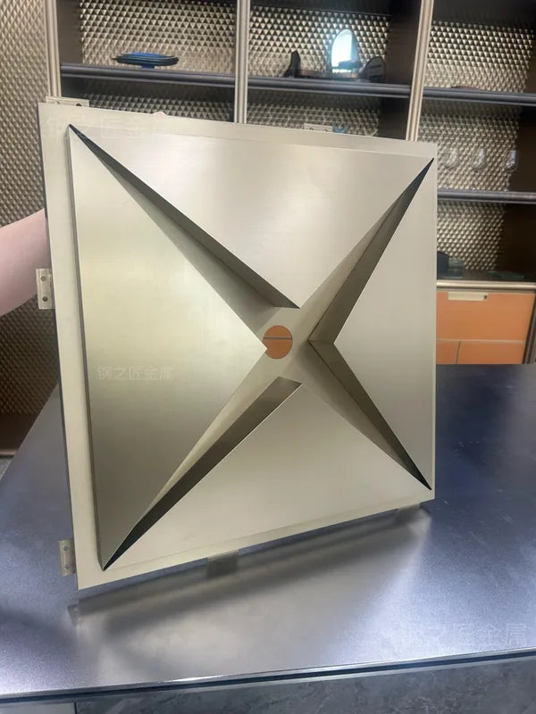 Rear side of metal star ceiling module showing folded geometry