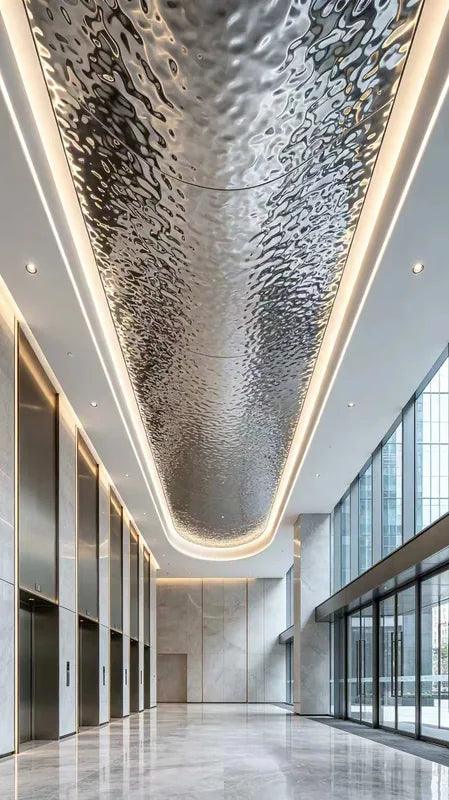 Rounded rectangular ripple ceiling concept in glazed lobby