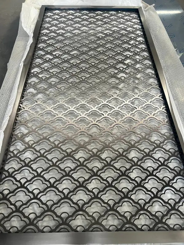Angled view of Silver Scallop stainless steel Lattice Screen