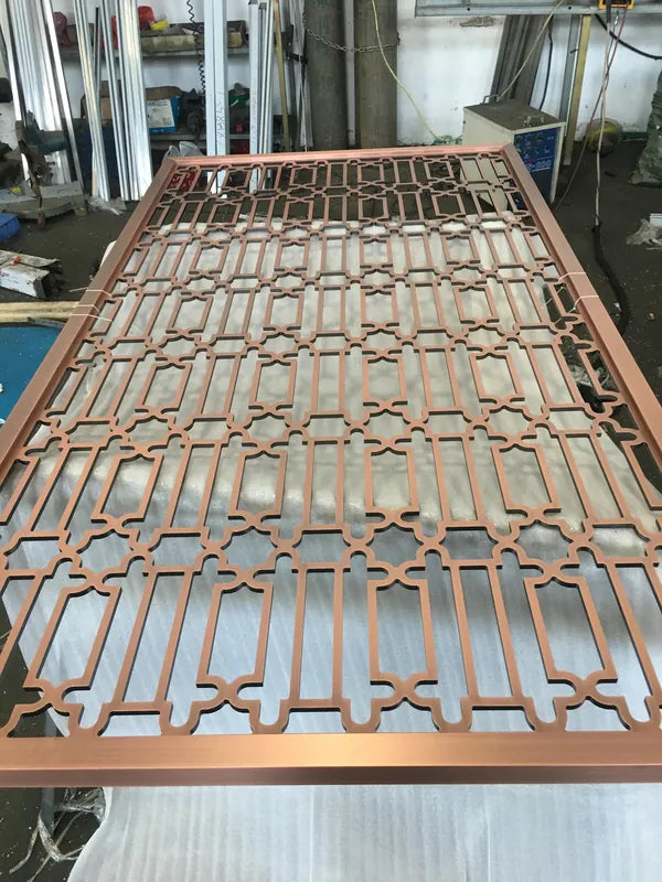 Close detail of Gold Triangle Maze stainless steel Screen Panel