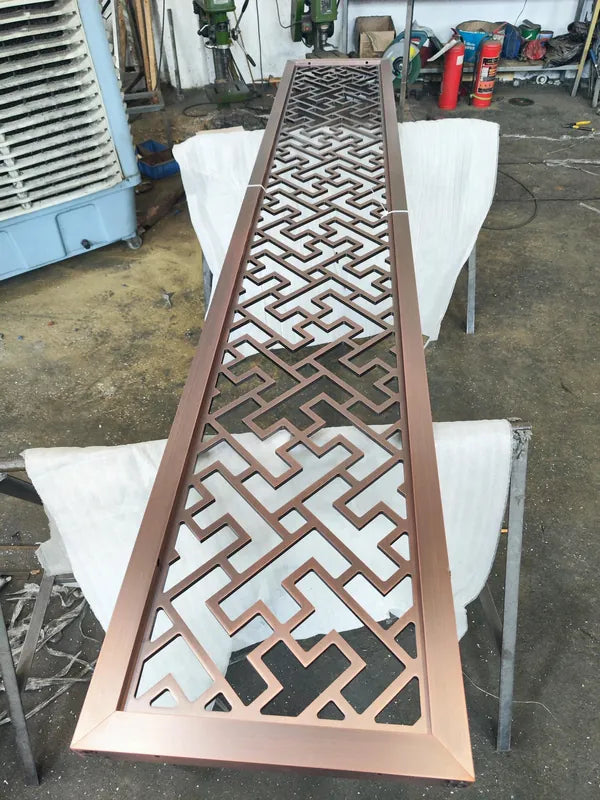 Angled view of Bronze Linear Art Deco stainless steel Screen