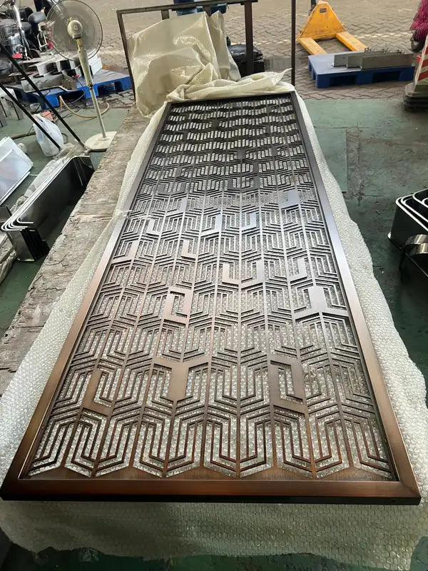 Close detail of Bronze Geometric Cutout stainless steel Screen
