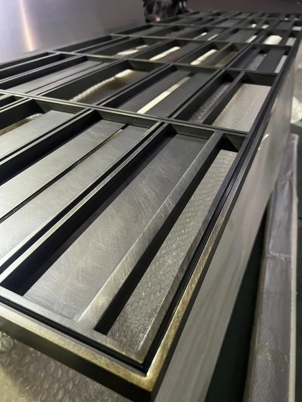 Angled view of Bronze Linear Slat stainless steel Screen Panel