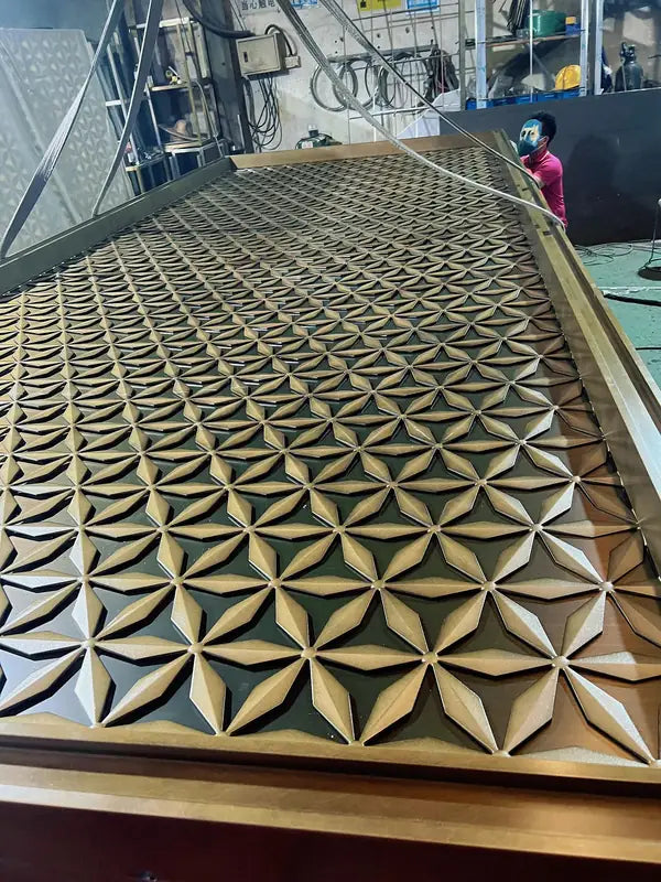 Close detail of Bronze 3D Faceted stainless steel Screen Panel