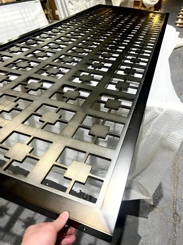 Angled view of Black Cross Motif Laser Cut stainless steel Screen