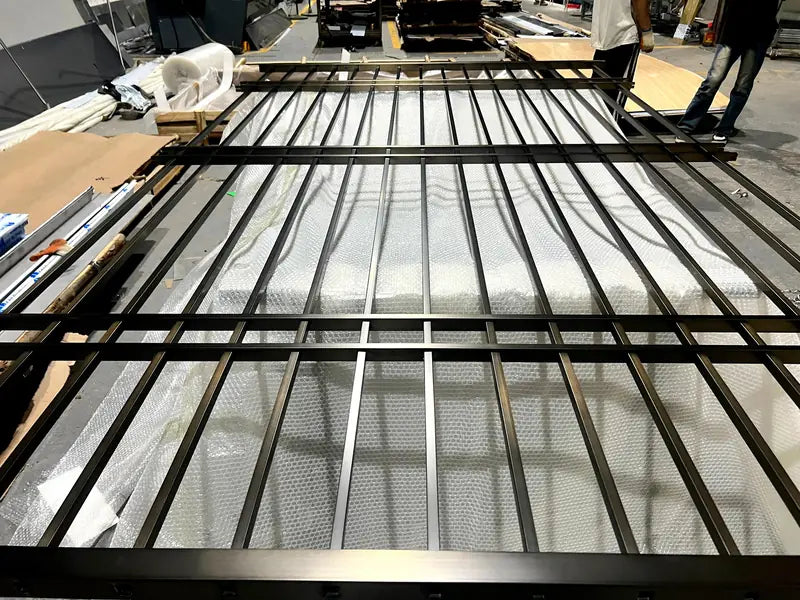 Angled view of Black Vertical Slat stainless steel Room Divider