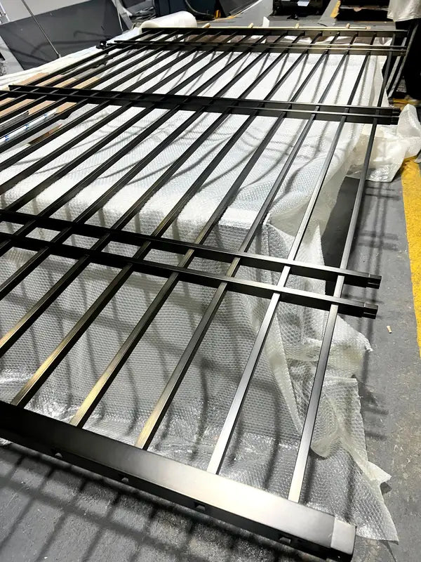 Close detail of Black Vertical Slat stainless steel Room Divider