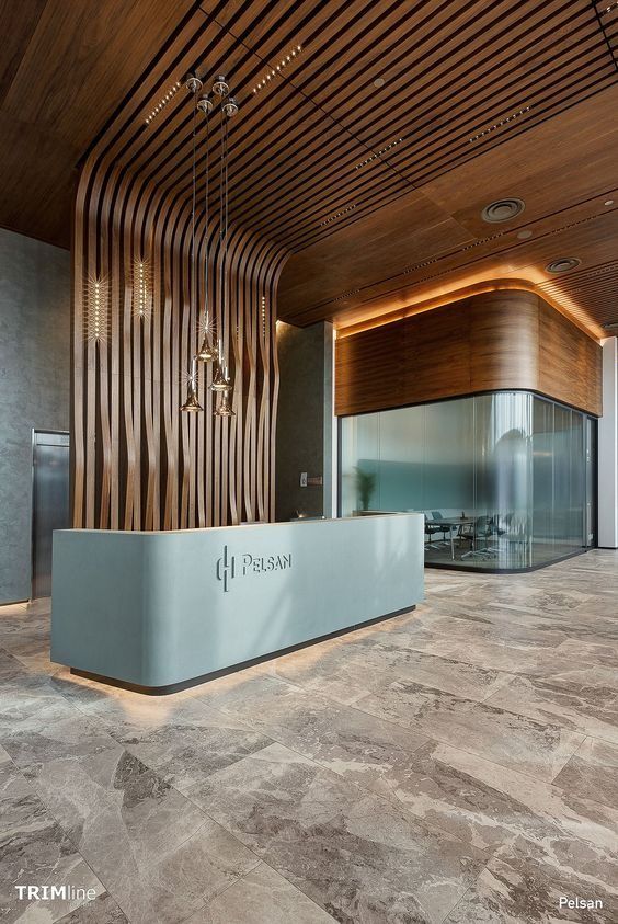 Linear warm-bronze stainless steel hotel reception desk for multi-position check-in areas