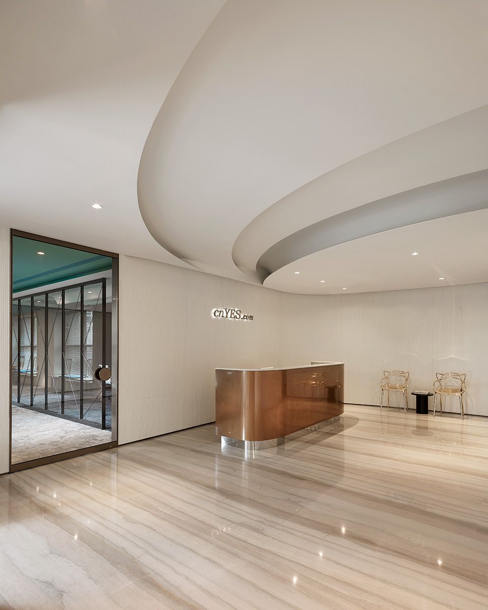 Linear warm-bronze stainless steel hotel reception desk for multi-position check-in areas