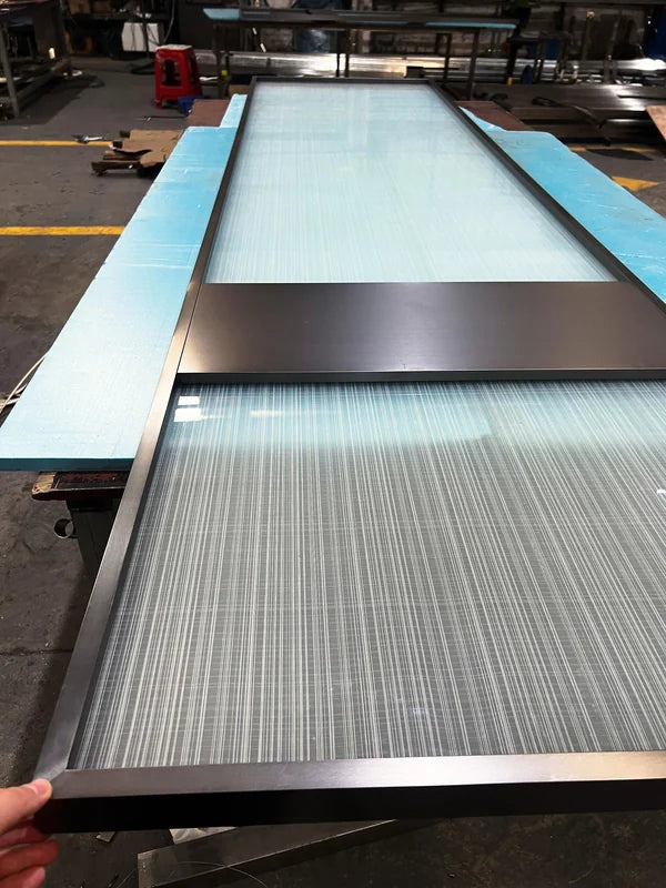Angled view of Black Double Panel Reeded Glass stainless steel Screen