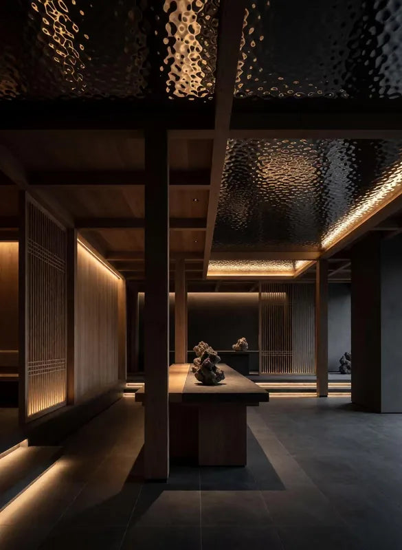 Tea room interior with warm-lit reflective ceiling panels
