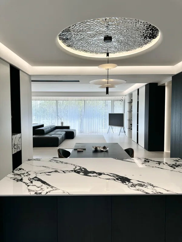 Wide kitchen and living view with round water ripple ceiling
