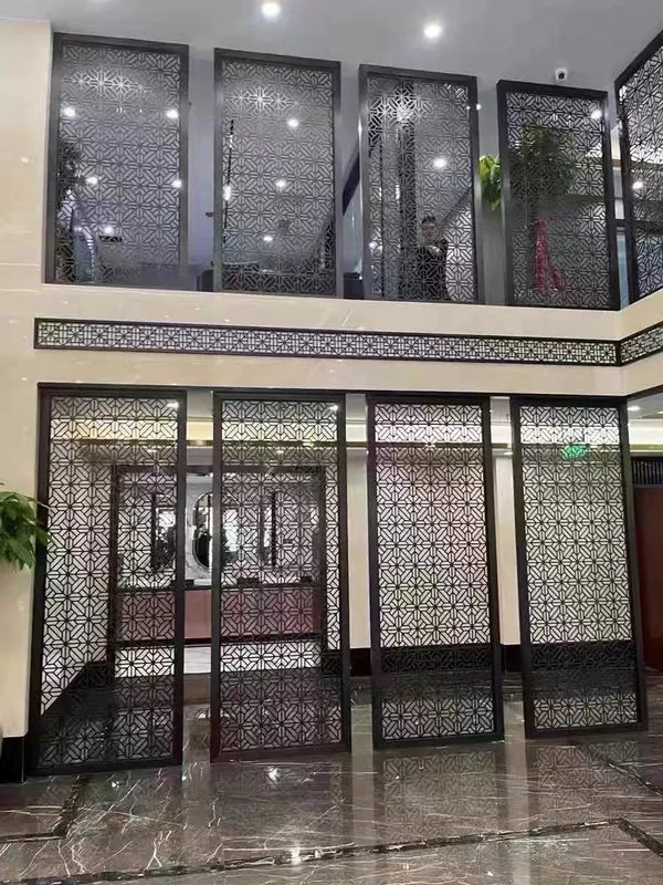 Bronze lattice stainless steel screen panels installed at an interior entrance