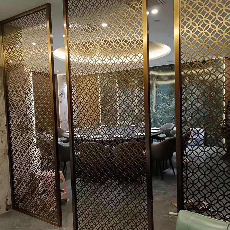 Bronze stainless steel lattice screen beside a hotel lounge