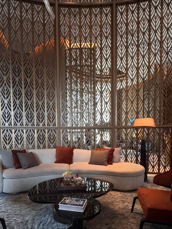 Geometric metal screen partition in a hospitality lounge