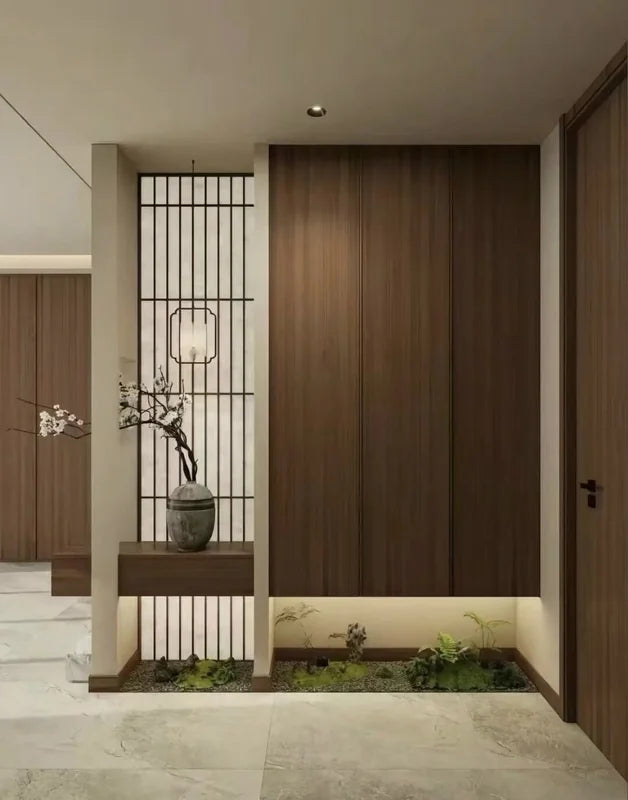 Dark geometric stainless steel screen partition at a home entrance