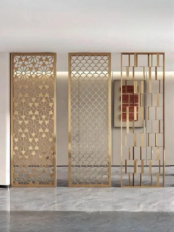 Gold patterned stainless steel screen partition in a lobby