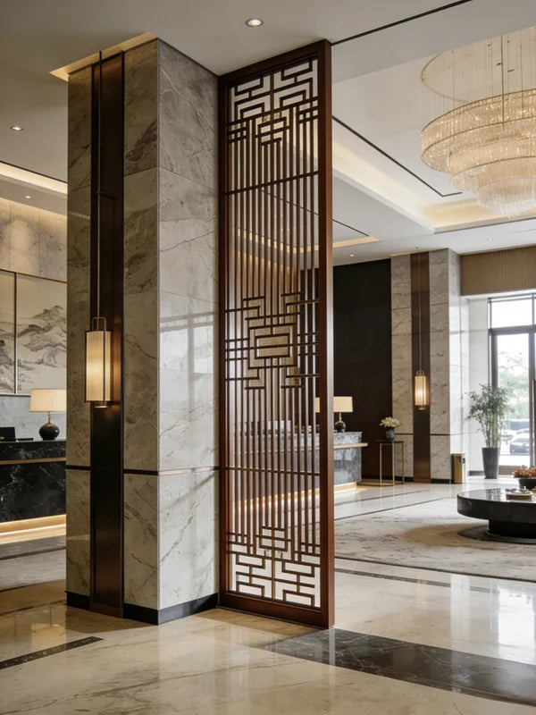 Bronze-toned geometric stainless steel screen in a reception lobby