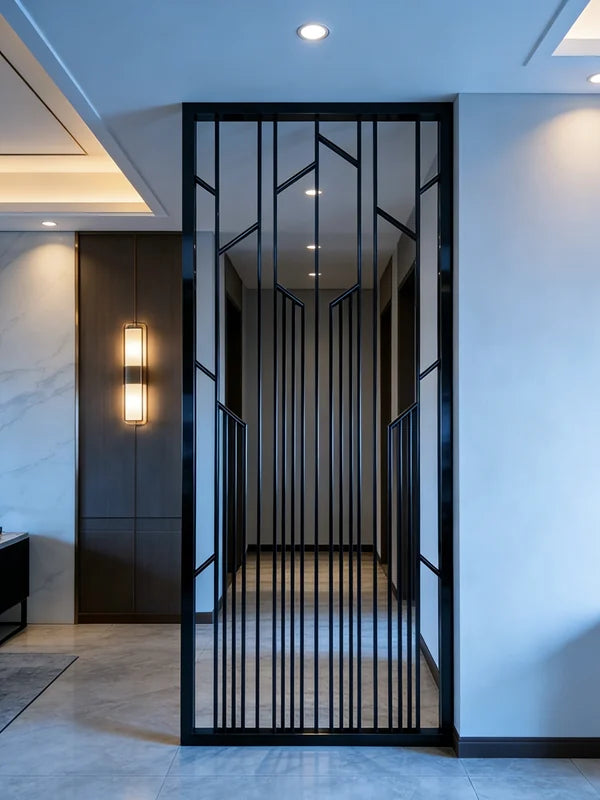 Dark stainless steel vertical grille screen at a contemporary entrance