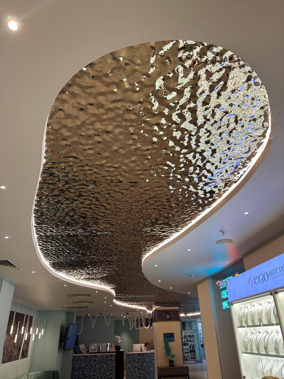 xinmaometal-bronze-water-ripple-stainless-steel-ceiling-retail-interior