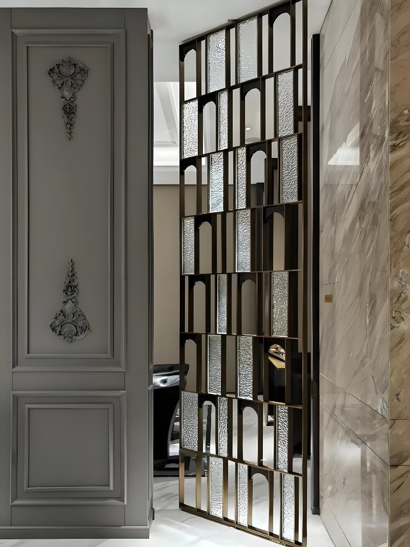 Dark stainless steel framed screen with arched translucent panels beside a living room.