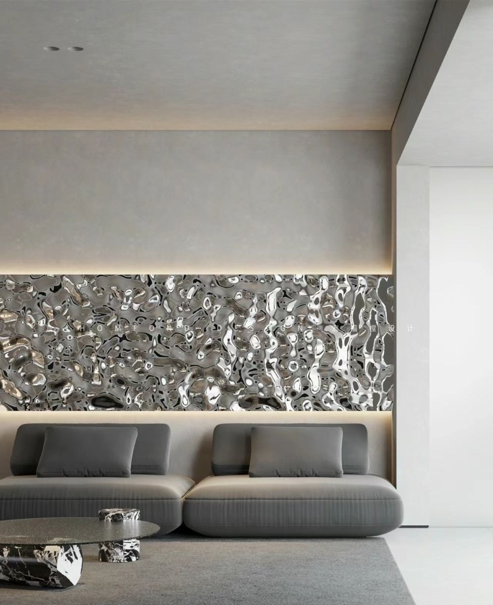 Silver corrugated stainless steel feature wall panels behind a contemporary living room sofa.